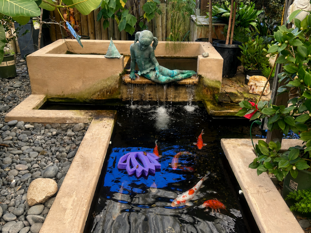 Lotus Flower Bee Raft floating in a koi pond to help bees in extreme heat access water safely